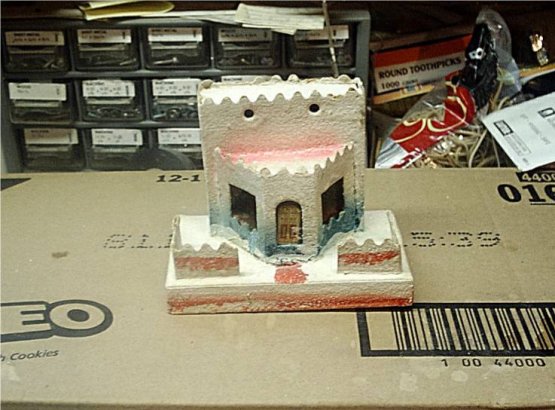 Cleaning cardboard Christmas village houses with 
bleach