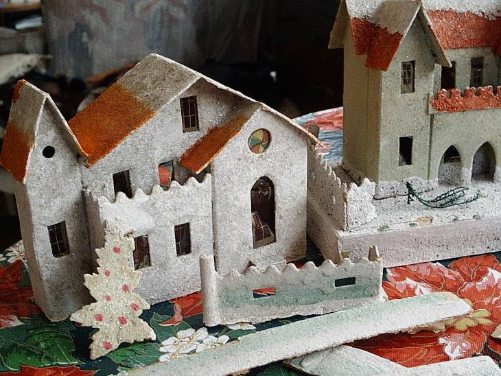 Cleaning cardboard Christmas village houses