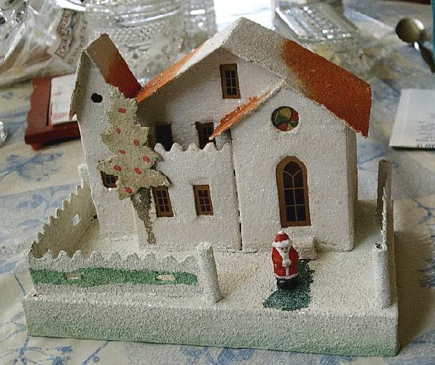 Cleaning cardboard Christmas village houses