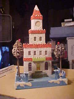 Chritmas village house with
 clock