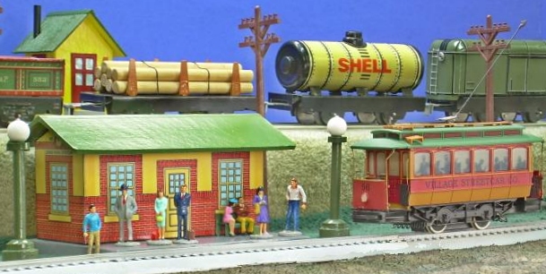Howard Lamey's hand-built station and watchman's shanty are accompanied by home-made light posts and cheap figures he adapted for vintage-style displays.