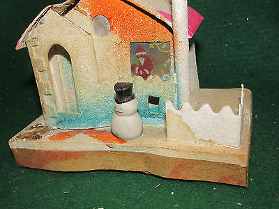 my hacienda santa in window-top hat snowman outside putz house.jpg