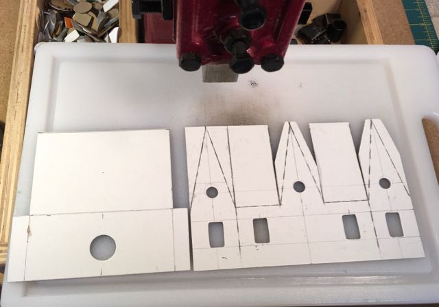 Cutting out Silver and grey Dresden tile house.jpg