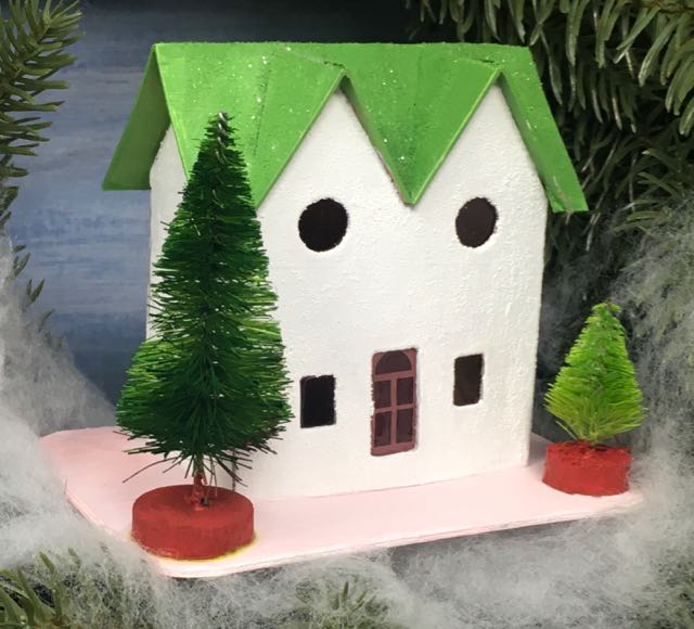 Green twin gable house in Christmas wreath.jpg