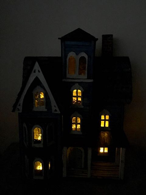 Photo of little putz house in dark with lights on.jpg
