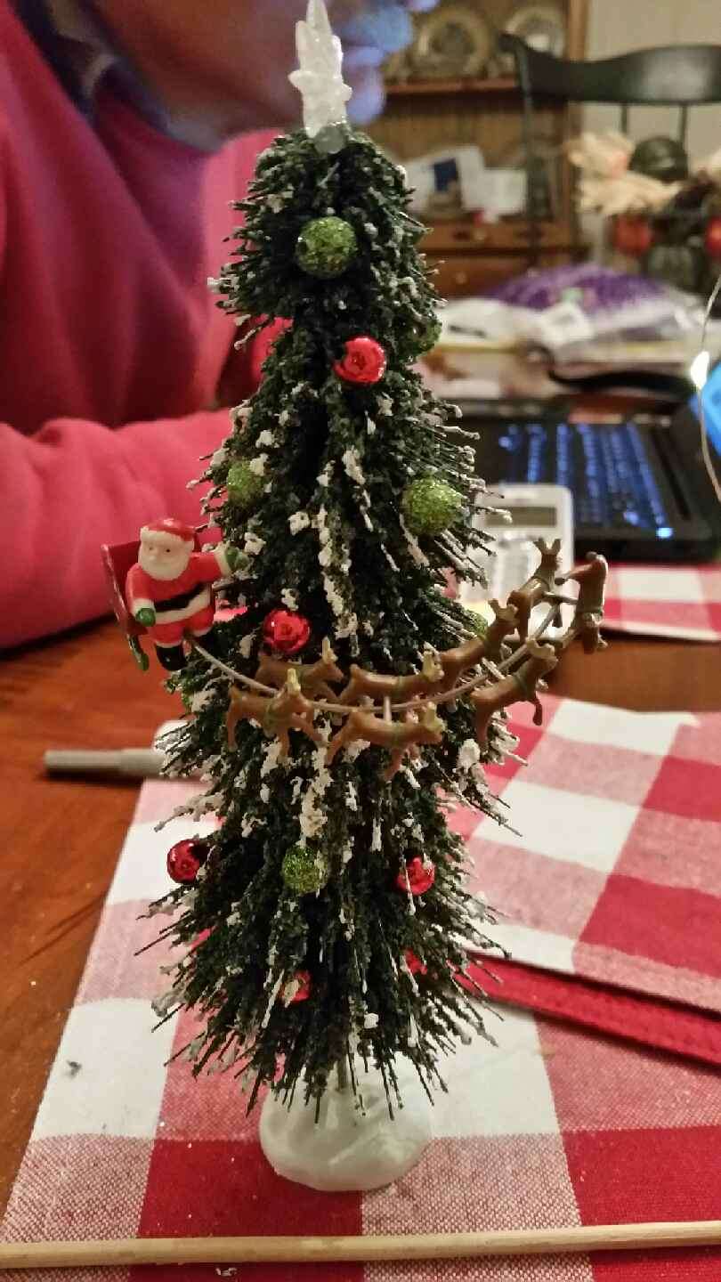 Santa gets glued.  One reindeer is standing on his head